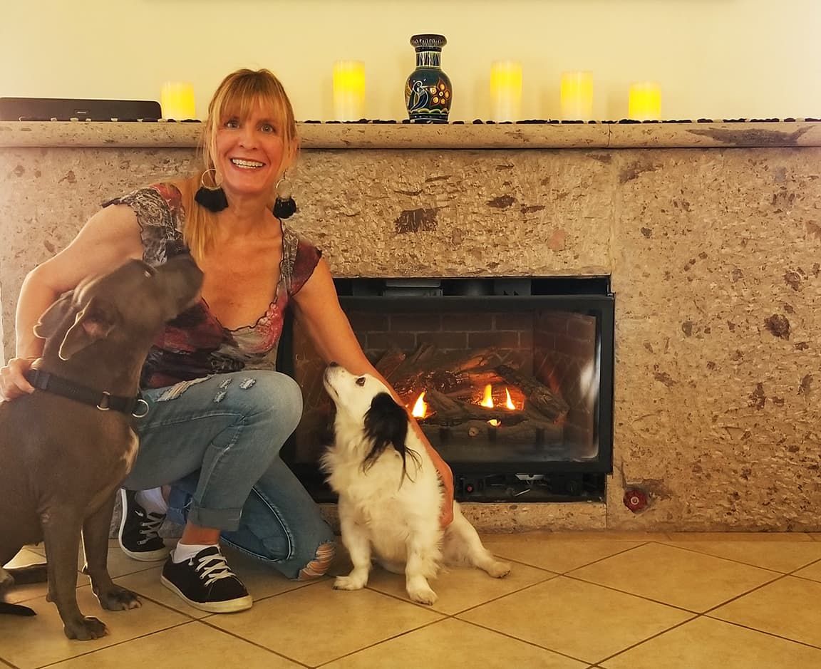 Joanie Rabbie and Patches in front of fireplace